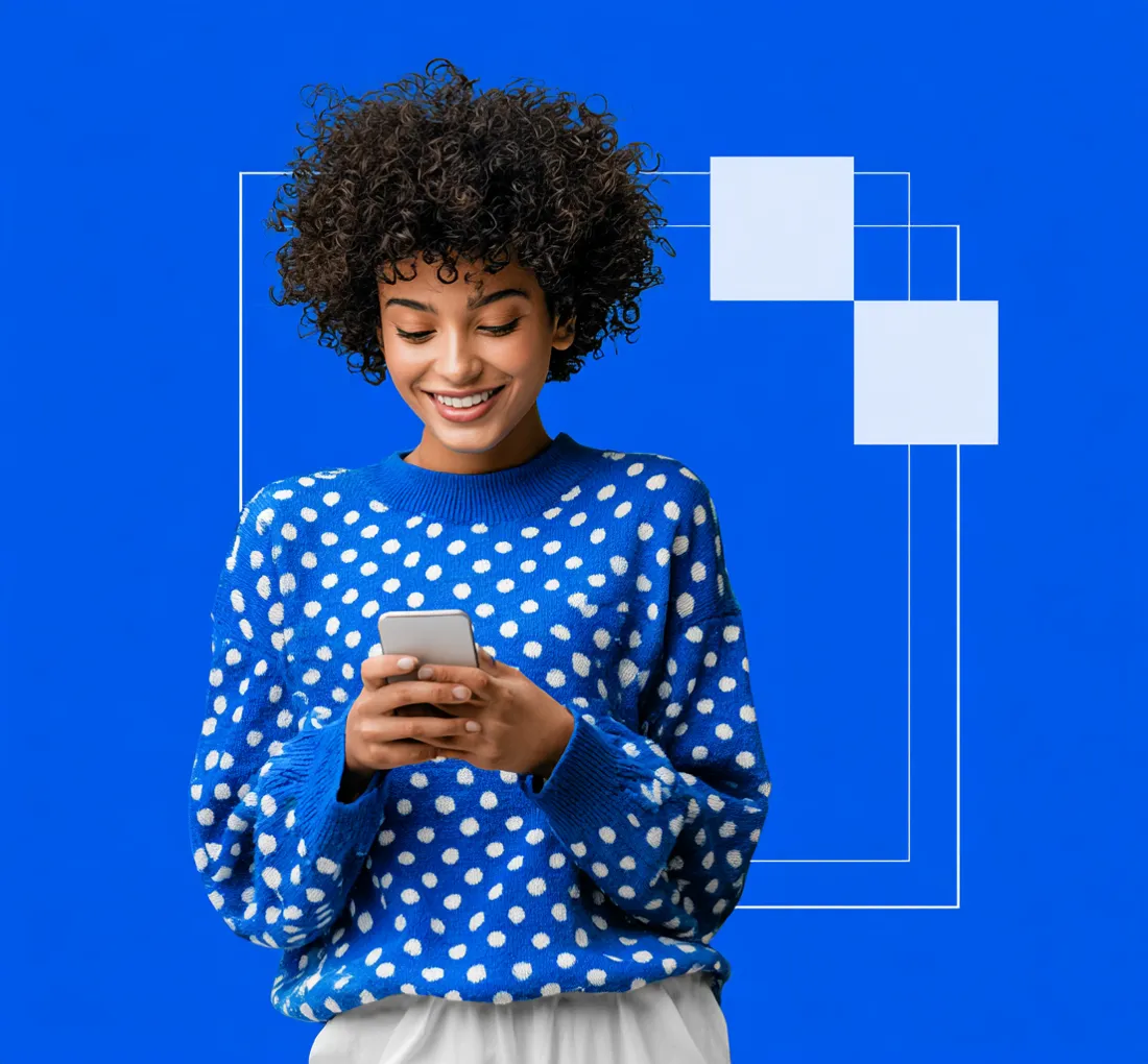 Woman smiling at her phone after a top-up